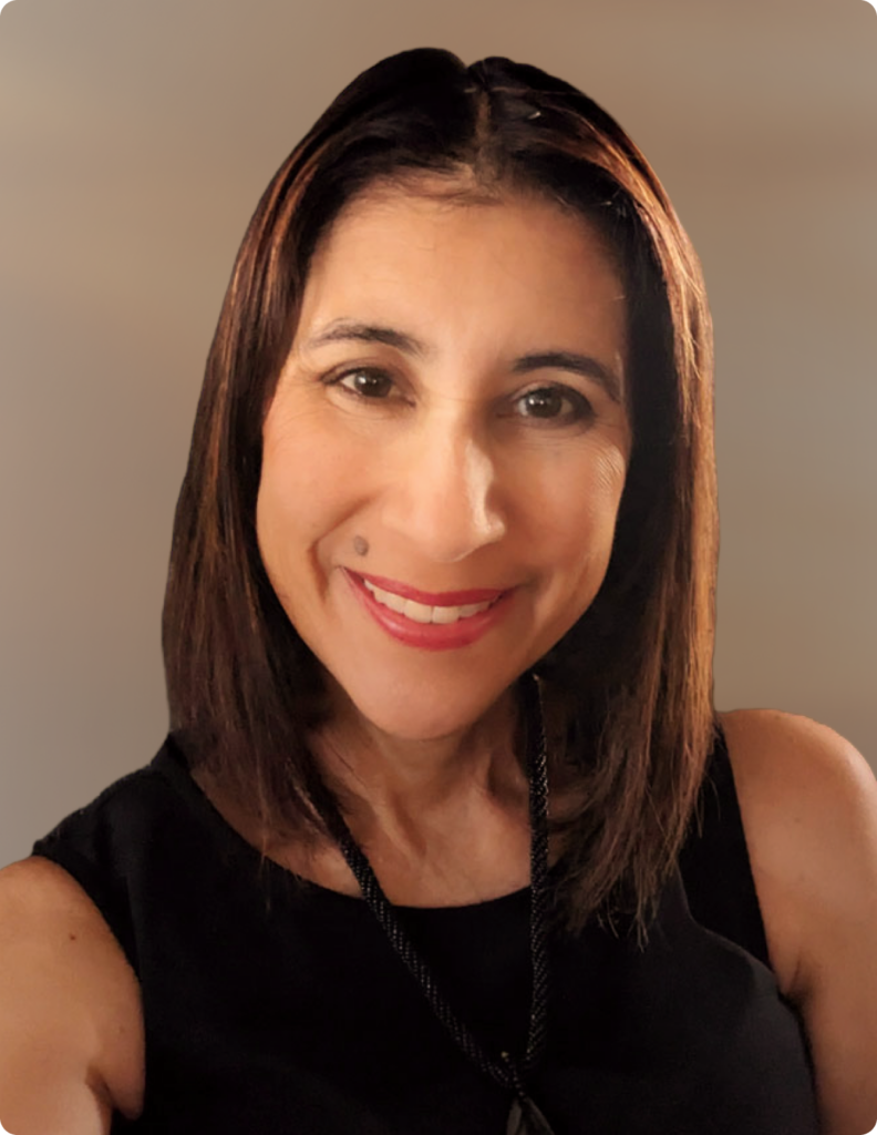 Headshot of woman wearing black dress in front of white background.