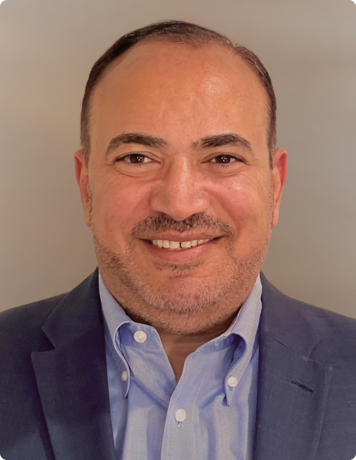 Headshot of Damian Williams in front of white background.